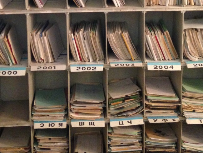 photo of a shelf covered in paper files