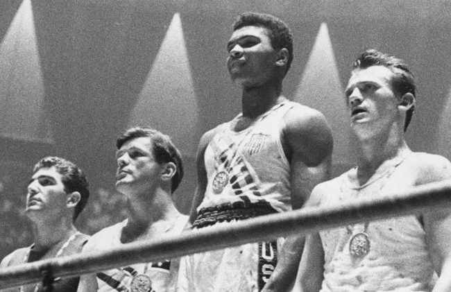 Photo of Muhammad Ali and three others at the Olympics